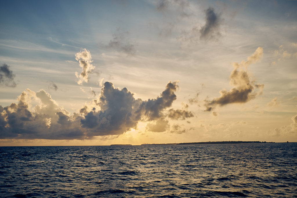 sunset over the waters of Finolhu